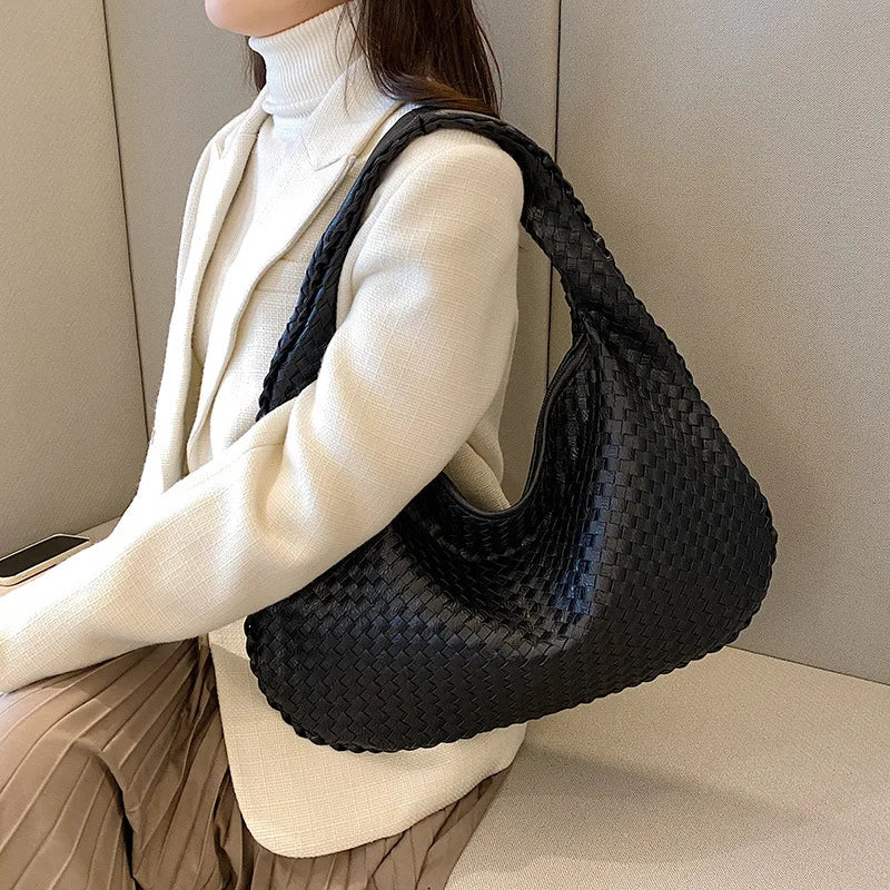 https://cdn.shopifycdn.net/s/files/1/0587/4132/5898/files/New-Fashion-Tote-Designer-Woven-High-Quality-Women-s-Shoulder-Bags-Luxury-Leather-Large-Capacity-Tote_jpg.webp?v=1710944919