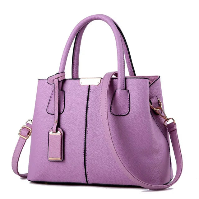 https://cdn.shopifycdn.net/s/files/1/0752/7143/8651/files/Famous-Designer-Brand-Bags-Women-Leather-Handbags-New-Luxury-Ladies-Hand-Bags-Purse-Fashion-Shoulder-Bags_35cc4c81-ec1b-4b1e-a736-21dcfb99a3fa.webp?v=1739323176