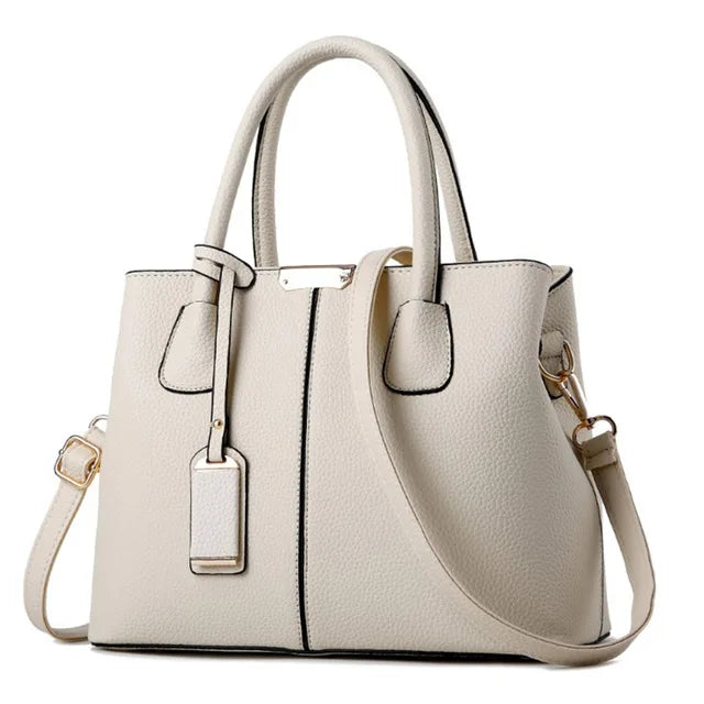 https://cdn.shopifycdn.net/s/files/1/0752/7143/8651/files/Famous-Designer-Brand-Bags-Women-Leather-Handbags-New-Luxury-Ladies-Hand-Bags-Purse-Fashion-Shoulder-Bags_e66bc823-aa36-46ac-a468-19bf6bb342f5.webp?v=1739323176