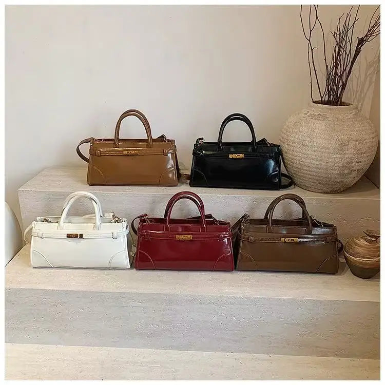 https://cdn.shopifycdn.net/s/files/1/0752/7143/8651/files/High-End-Burgundy-Briefcase-Ladies-Zipper-Large-Capacity-Underarm-Bag-Elegant-Retro-Women-s-Commuting-Handbag_8aef3ac4-0c07-449b-a00a-4f41f196fa27.webp?v=1739266834