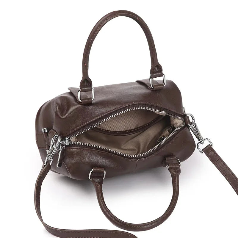 https://cdn.shopifycdn.net/s/files/1/0752/7143/8651/files/Vintage-messenger-bag-cowhide-Brown-leather-bag-Soft-Leather-Large-Capacity-minimalist-Crossbody-bag-women-female_749e6044-a7c4-4898-9b69-c8878596f58f.webp?v=1739266821