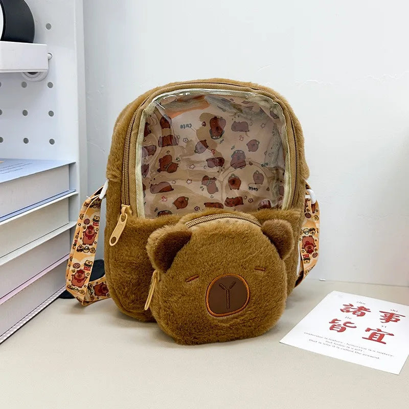https://cdn.shopifycdn.net/s/files/1/0752/7143/8651/files/Kawaii-Capybara-Plush-Backpack-for-Women-Versatile-Cartoon-Funny-Capibala-Crossbody-Bag-aLrge-Capacity-Tote-Bag_e009f0c9-eace-45bf-ba53-0f1f91763249.webp?v=1738829403