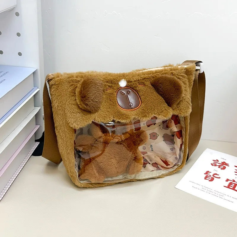 https://cdn.shopifycdn.net/s/files/1/0752/7143/8651/files/Kawaii-Capybara-Plush-Backpack-for-Women-Versatile-Cartoon-Funny-Capibala-Crossbody-Bag-aLrge-Capacity-Tote-Bag_366bebff-ea05-4845-aa27-c3d45feceec2.webp?v=1738829402