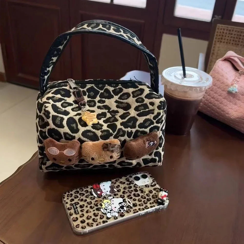 https://cdn.shopifycdn.net/s/files/1/0752/7143/8651/files/Hellokitty-Leopard-Cosmetic-Bag-Sanrio-Kawaii-Fashion-Cartoon-Handbag-Large-Capacity-Makeup-Case-Portable-Satchel-Backpacks_d1be76e5-b700-4b21-bc0d-7968d545b945.webp?v=1738829384