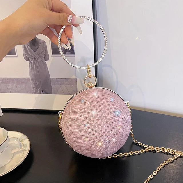 https://cdn.shopifycdn.net/s/files/1/0587/4132/5898/files/Circular-Ring-Portable-Evening-Bags-Metal-Round-Ball-Handbags-For-Lipstick-Elegant-Luxury-Clutch-Purse-Wedding.jpg_640x640.jpg_1.webp?v=1714186134