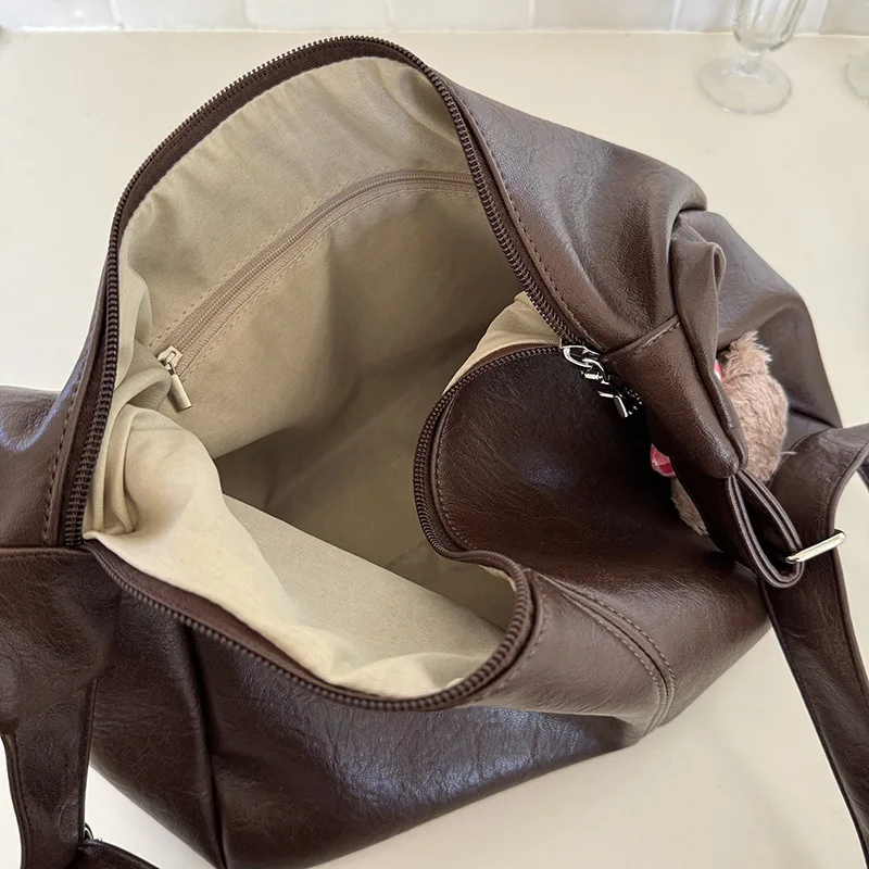 https://ae01.alicdn.com/kf/Sd95a21c296fb4cc283e1f8058592d139R/Damen-tasche-neue-Herbst-und-Winter-vielseitig-ins-Retro-Einkaufstasche-adrette-l-ssige-gro-e-kapazitive.jpg