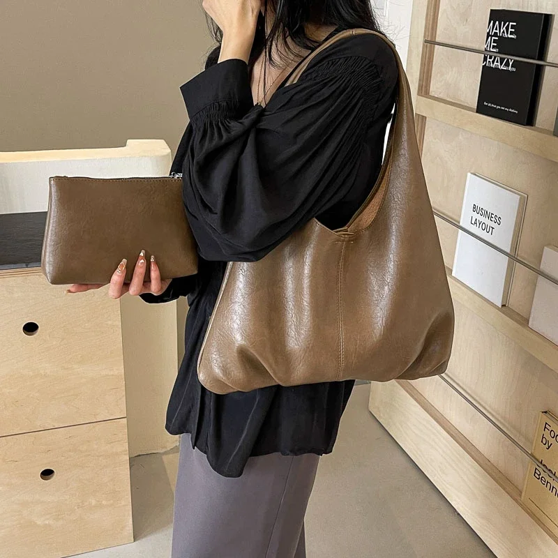 https://ae01.alicdn.com/kf/Sb93c66e2a70041b0a41065a95ff1b9b2J/2024-neue-2-Set-Tote-Damen-Tasche-gro-e-Kapazit-t-Umh-ngetaschen-schwarze-weiche-Leder.jpg