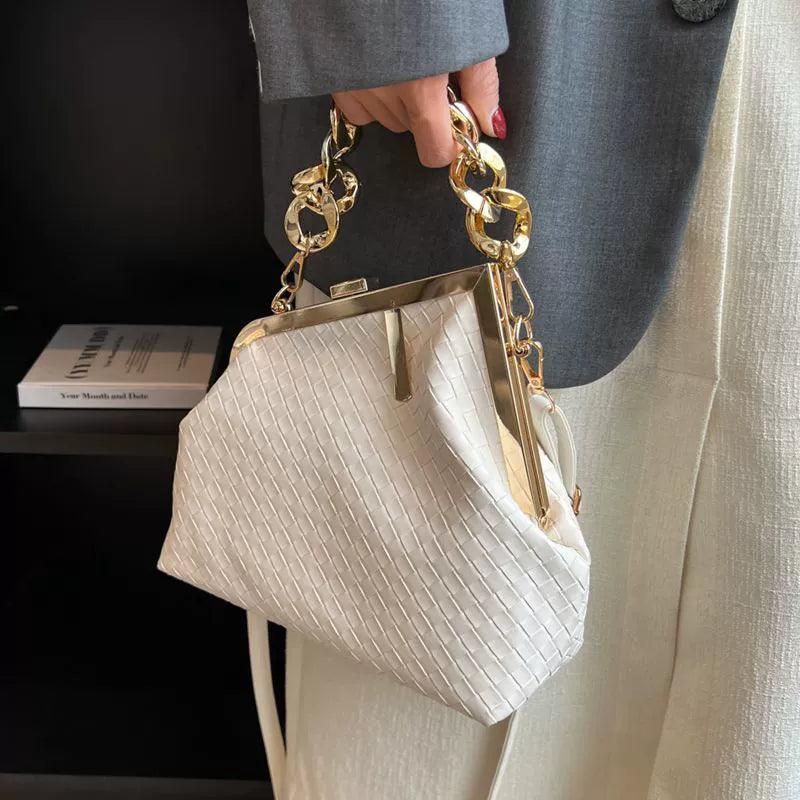 https://cdn.shopifycdn.net/s/files/1/0669/3876/5628/files/Carauana-UNIU-SILVER-GOLD-Knitted-Crossbody-Bag-Fashion-Satchel-NEW-2024-Collection-3.webp?v=1729464389
