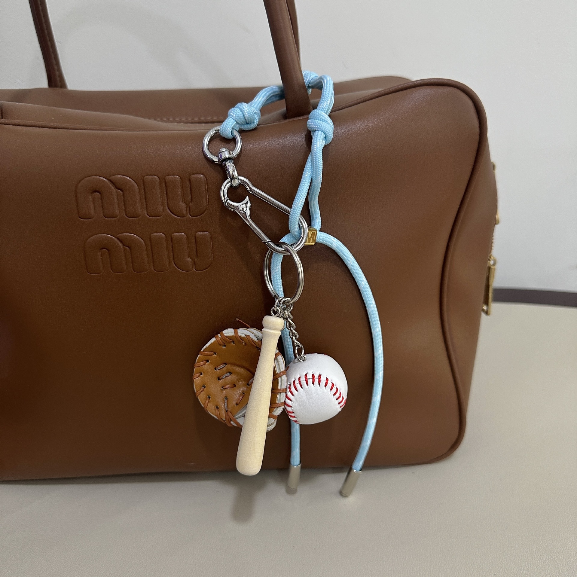 baby blue M-button+baseball pendant