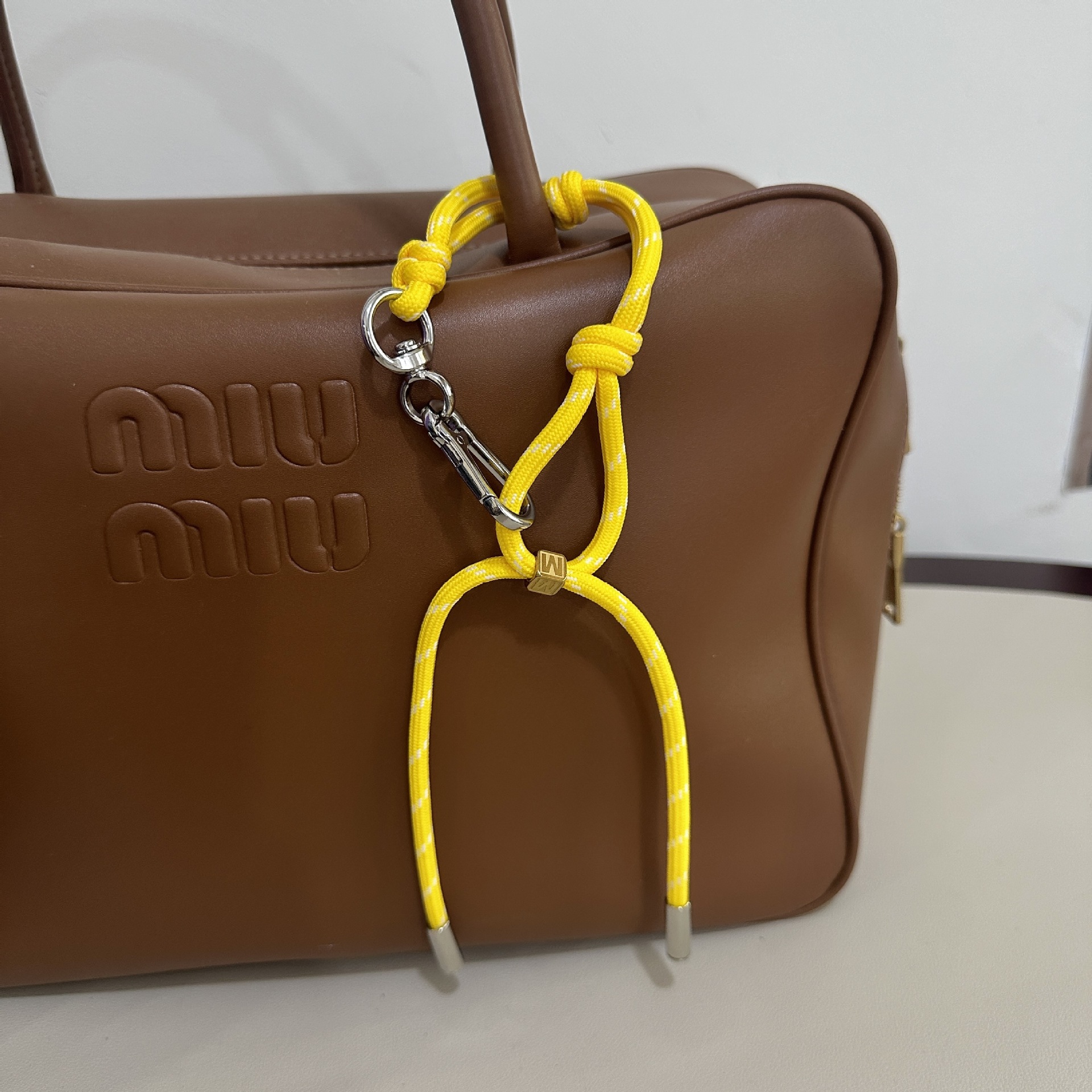 Bright yellow M buckle