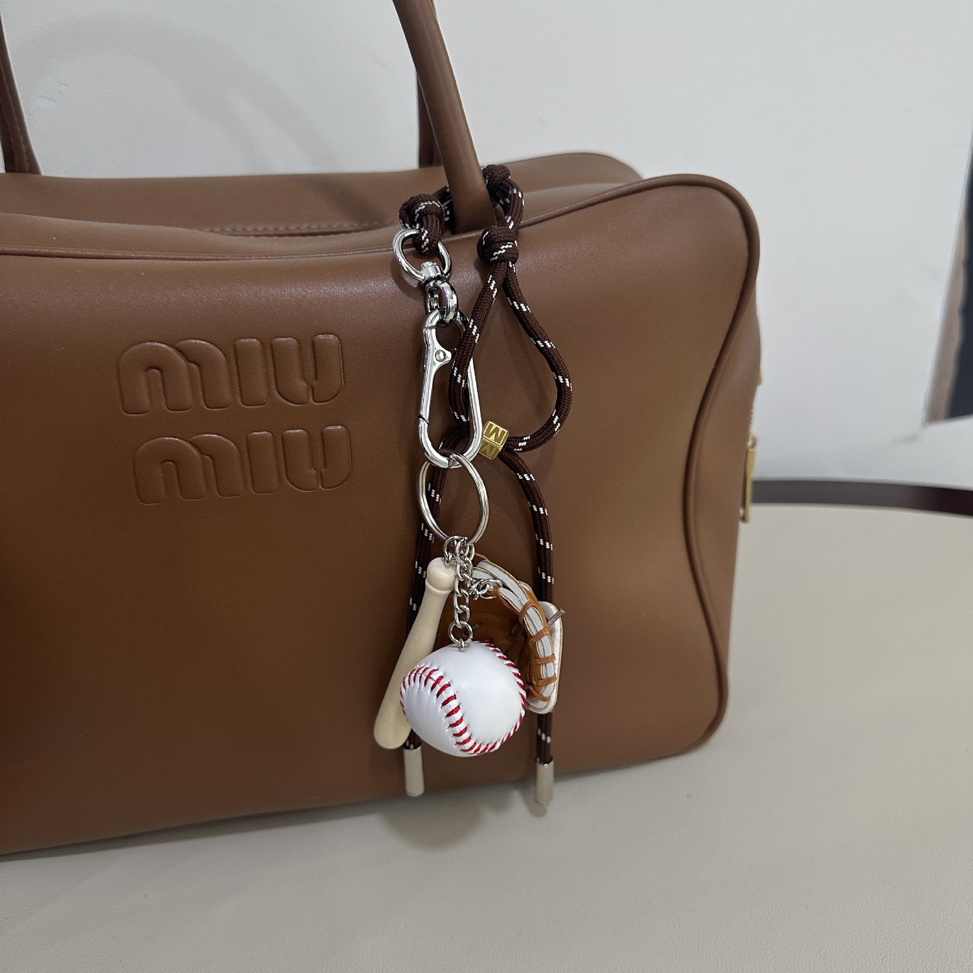 Coffee colored M button+baseball pendant